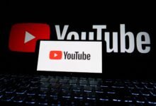 youtube logo on laptop screen in dark setting