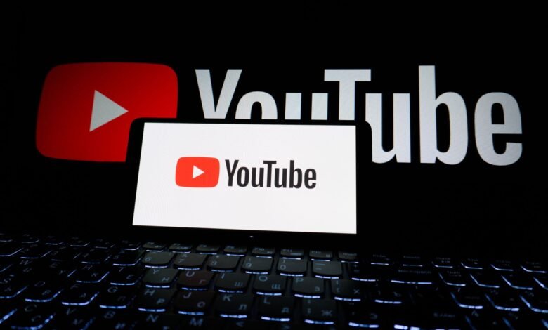 youtube logo on laptop screen in dark setting