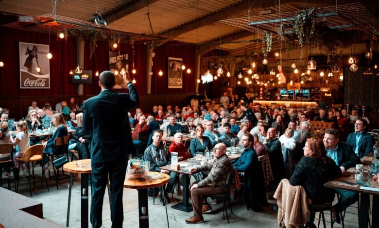 speaker engaging audience in packed venue