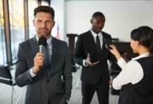 television reporter in front of a conference room