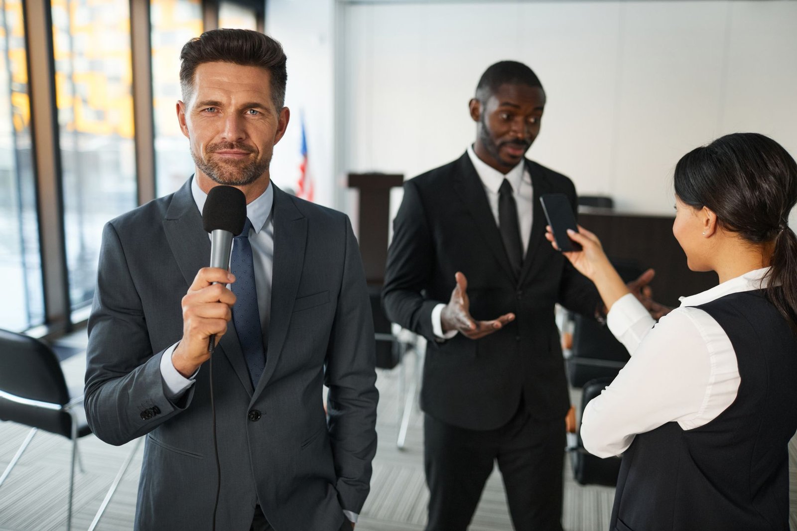 television reporter in front of a conference room