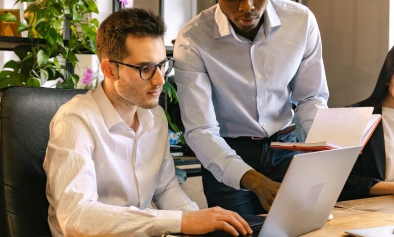 men working in a team in an office with potted plants