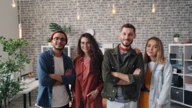 a group of people standing in an office