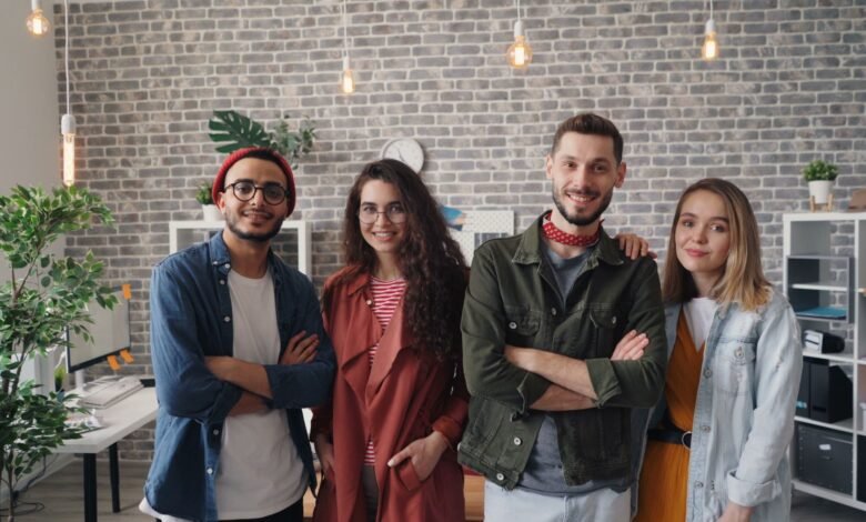 a group of people standing in an office