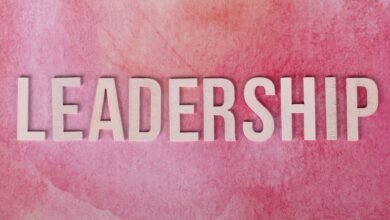 pink background with leadership text in bold letters