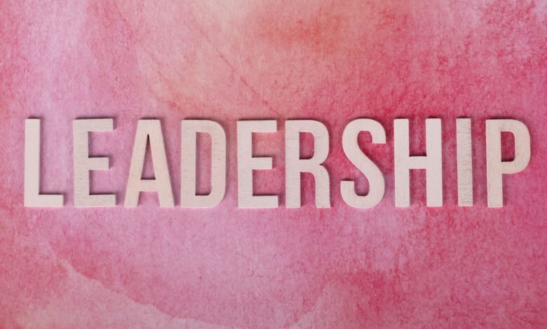 pink background with leadership text in bold letters