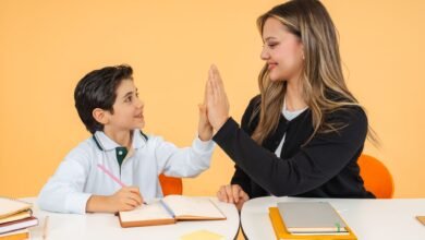 teacher and student high five in classroom setting