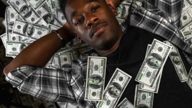 man lying down with money