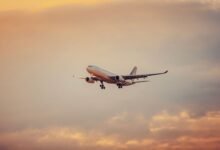 airplane in flight during sunset at schwechat