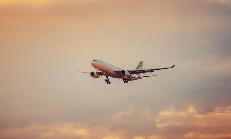 airplane in flight during sunset at schwechat