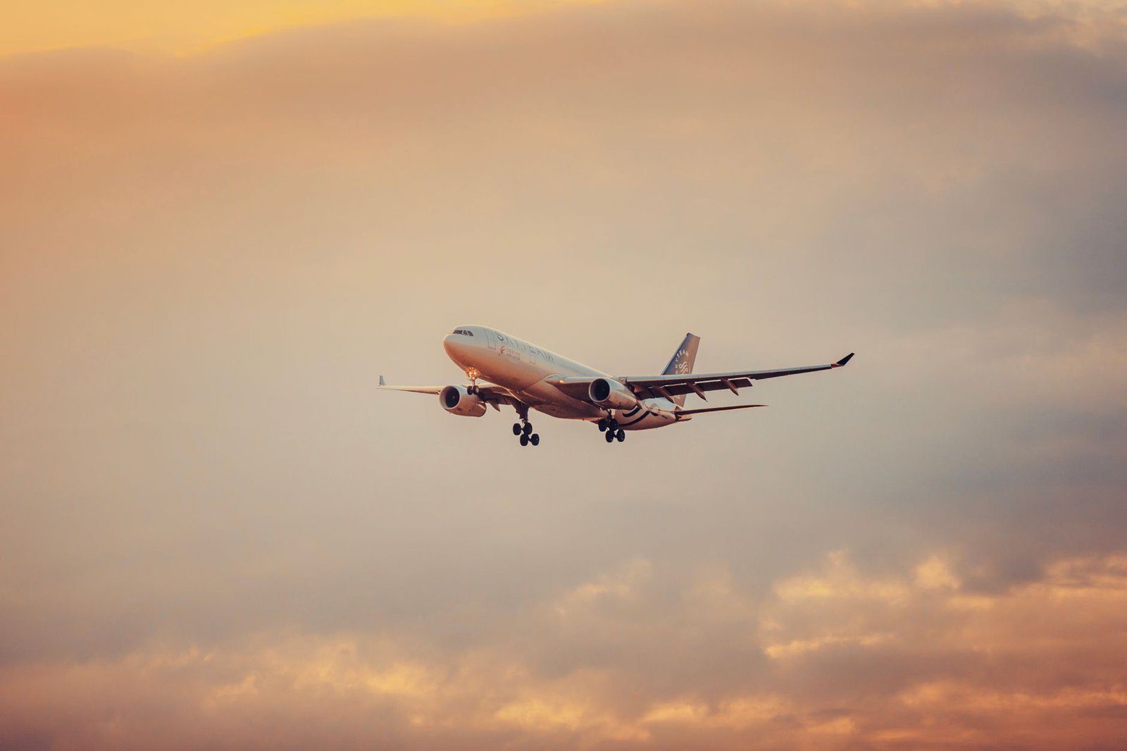 airplane in flight during sunset at schwechat
