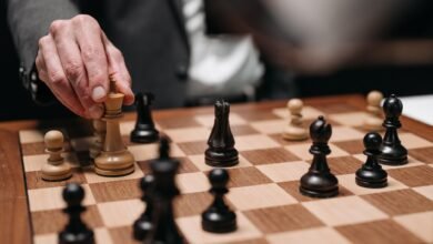 hand holding a chess piece