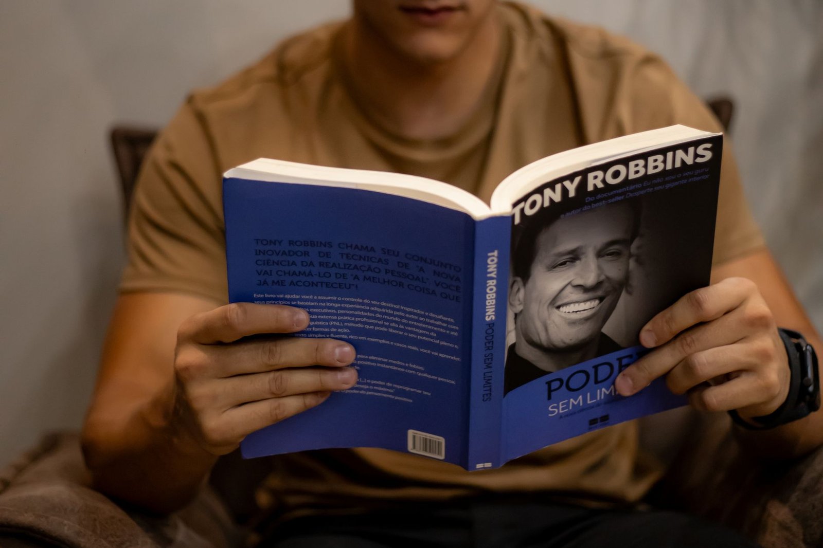 motivational book in hands of man