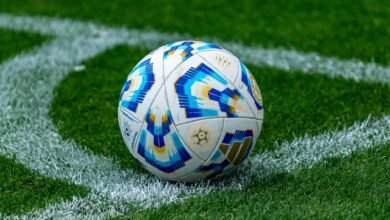 close up of soccer ball on football field