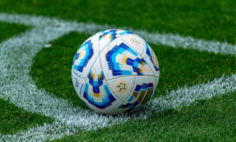 close up of soccer ball on football field
