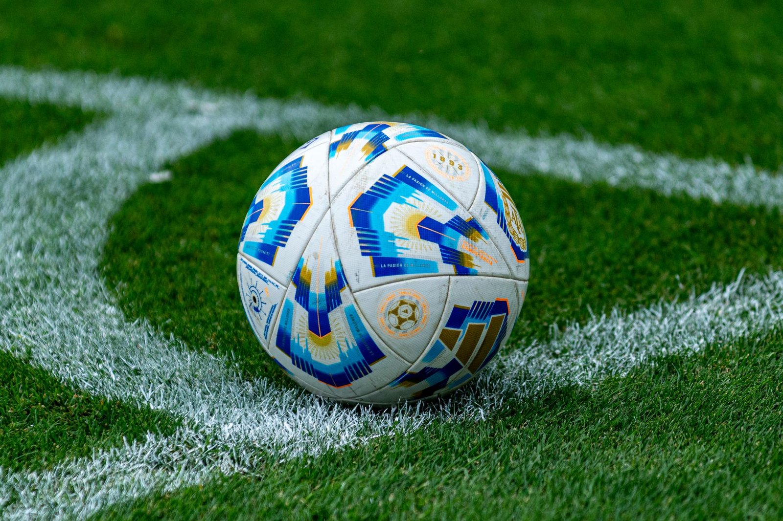 close up of soccer ball on football field