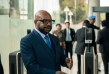 businessman entering corporate office building