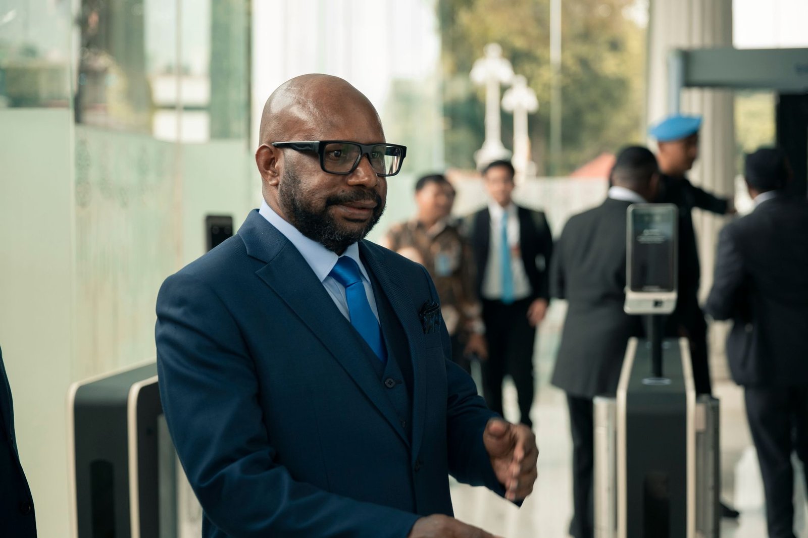 businessman entering corporate office building