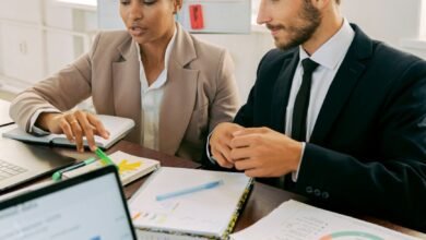 a man and woman working in the office