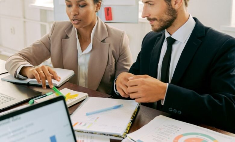 a man and woman working in the office