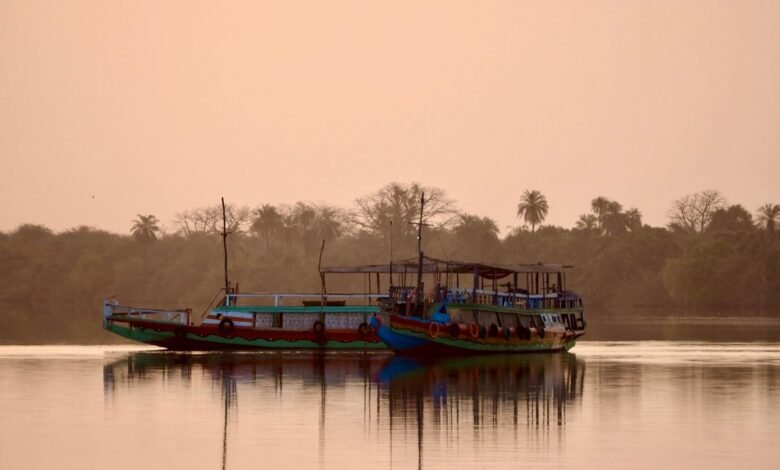 fishing boats in a lake during sunset