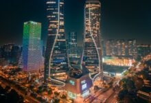 futuristic skyline of illuminated city at night