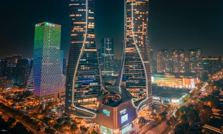 futuristic skyline of illuminated city at night
