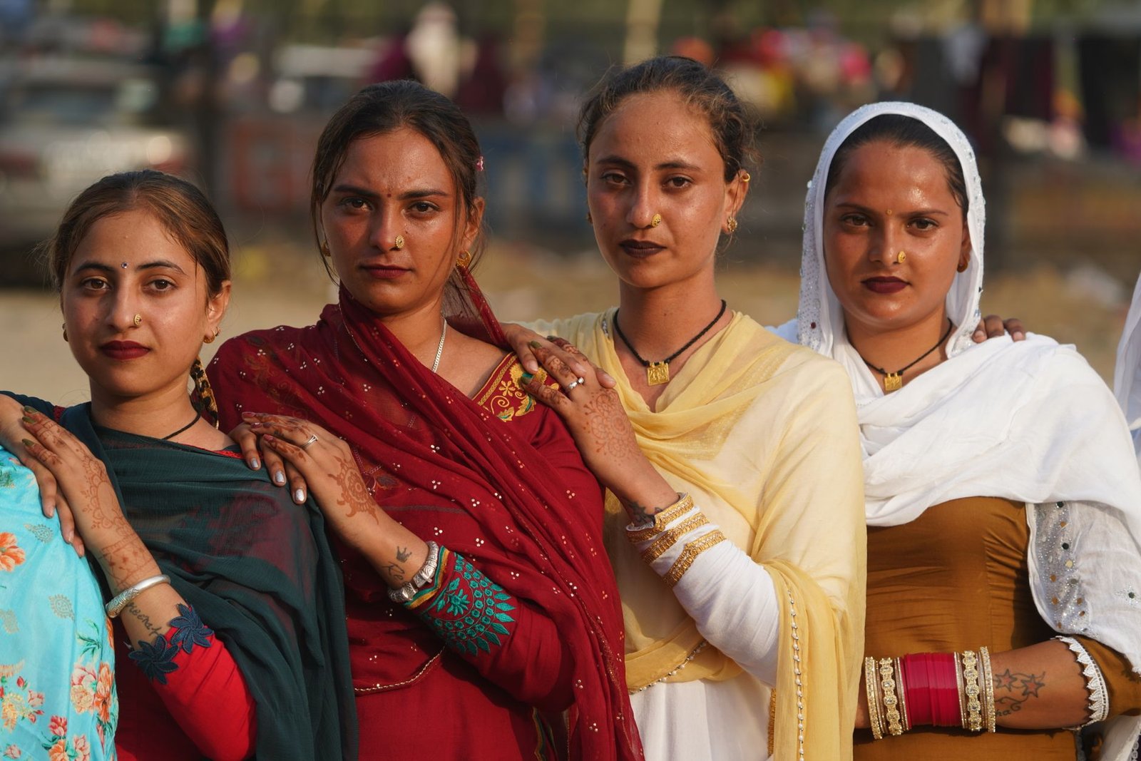 cultural portrait of four women in traditional attire