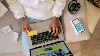 woman sitting on a couch and online shopping