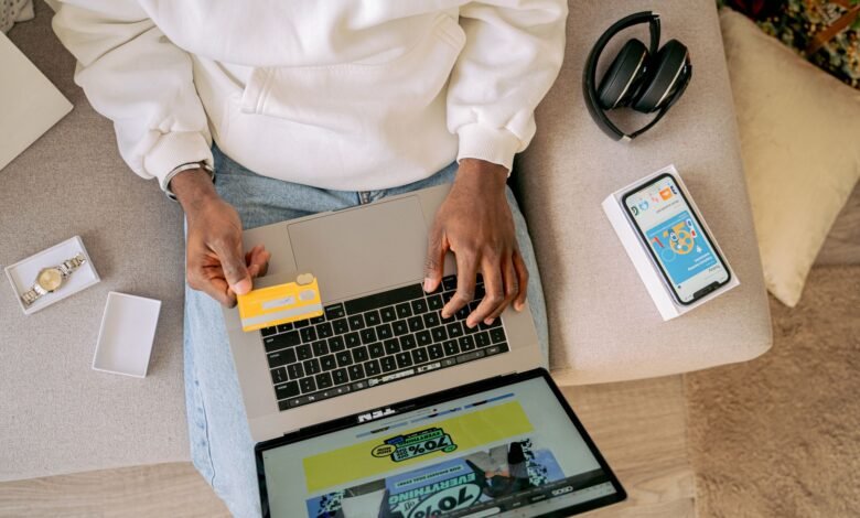 woman sitting on a couch and online shopping