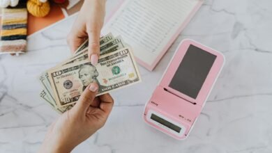 hands holding dollars