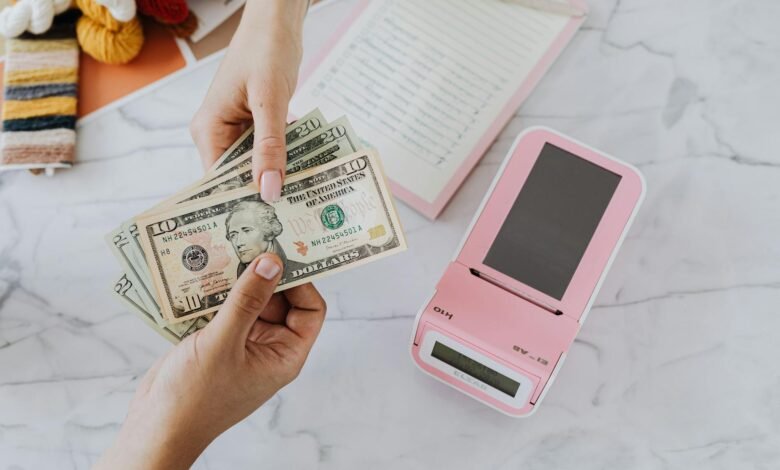 hands holding dollars