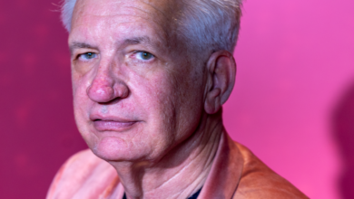 portrait of senior man in pink jacket