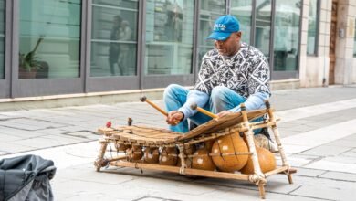 street performer playing xylophone in city square