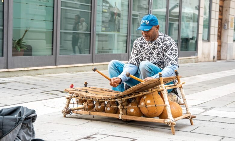 street performer playing xylophone in city square