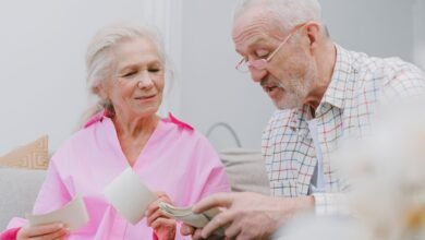 a couple with gray hair looking at photos together
