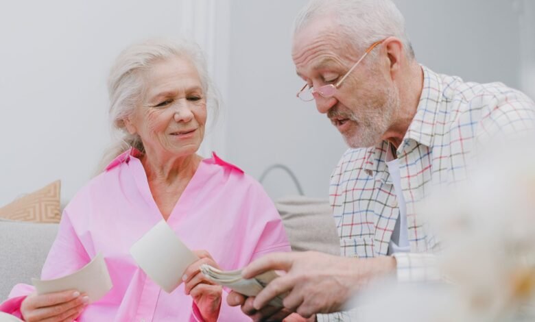 a couple with gray hair looking at photos together