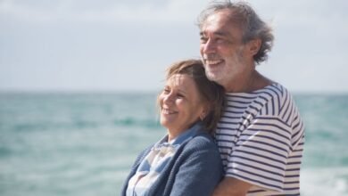 elderly couple hugging
