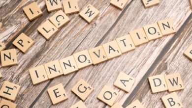 the word innovation spelled out in scrabble tiles