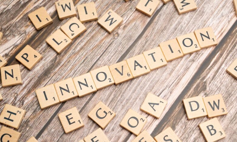 the word innovation spelled out in scrabble tiles