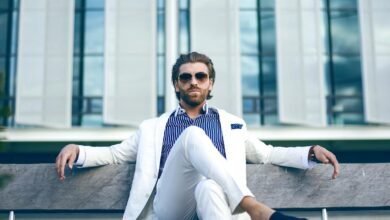 man wearing white suit jacket and white pants
