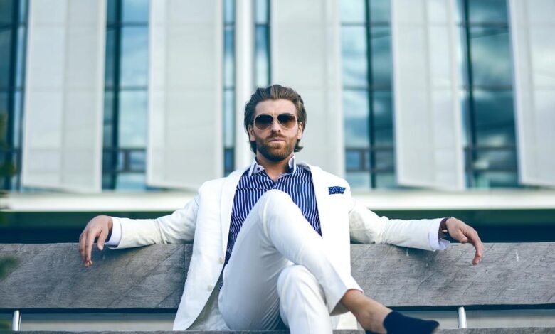 man wearing white suit jacket and white pants