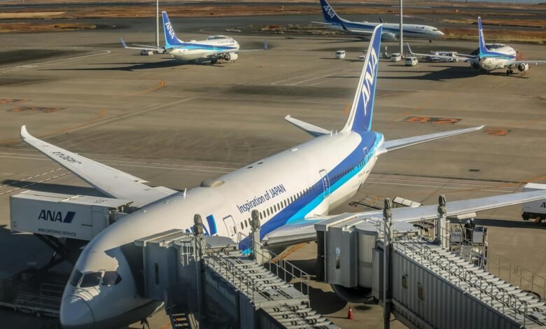 passenger planes at airport terminal with jet bridge
