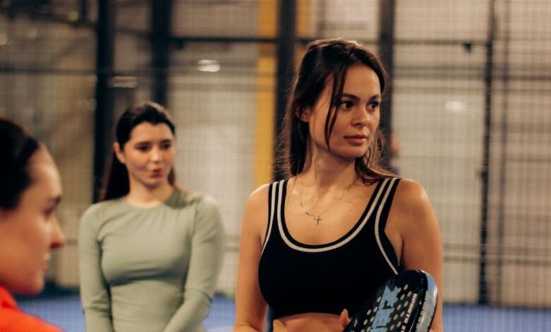 women playing paddle tennis indoors