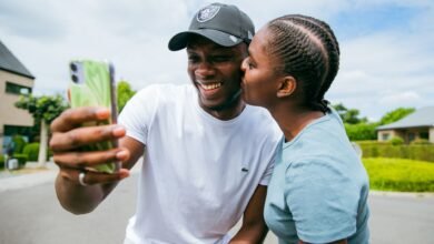 happy couple taking a selfie outdoors in brussels