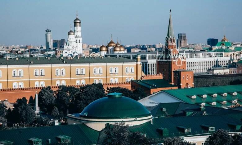 cityscape with towers and green roofs
