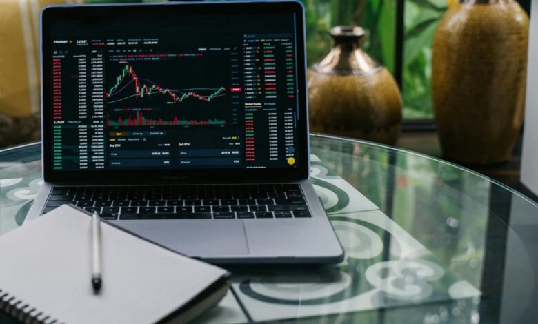 cryptocurrency chart displayed on a laptop