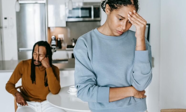 black couple arguing with each other in kitchen
