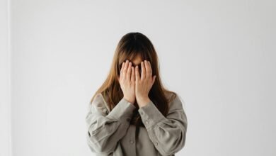 woman with hands on face