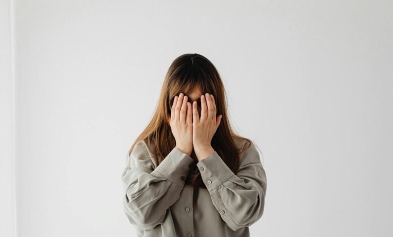woman with hands on face